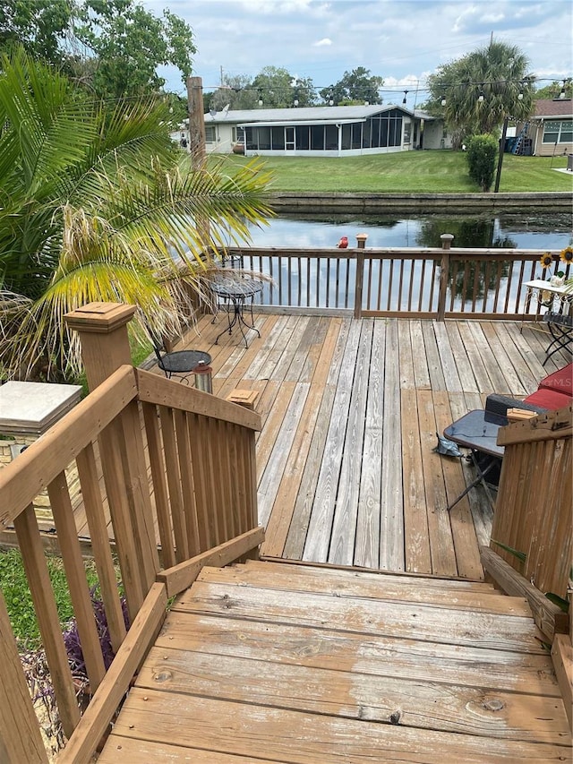 wooden deck with a water view