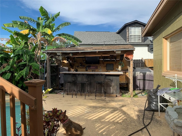 view of patio / terrace with grilling area and exterior bar