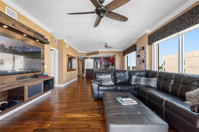 living room with dark hardwood / wood-style flooring and crown molding