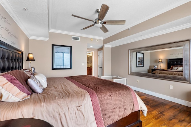 bedroom featuring a textured ceiling, ceiling fan, crown molding, and hardwood / wood-style flooring