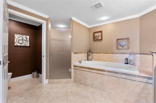 bathroom with a textured ceiling, tile patterned floors, shower with separate bathtub, toilet, and ornamental molding