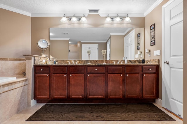 bathroom featuring a relaxing tiled tub, tile patterned flooring, a textured ceiling, crown molding, and vanity