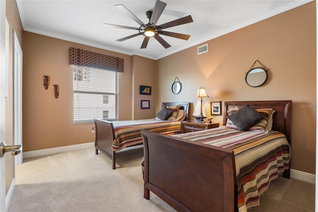 bedroom featuring ceiling fan, light carpet, and crown molding