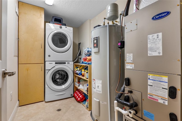 laundry area featuring stacked washer / drying machine, electric water heater, heating unit, and a textured ceiling