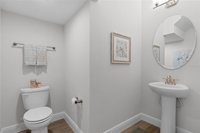 bathroom featuring toilet and hardwood / wood-style floors