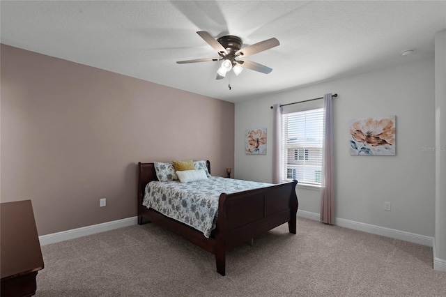 bedroom featuring light carpet and ceiling fan