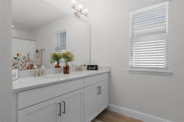 bathroom with vanity and hardwood / wood-style floors