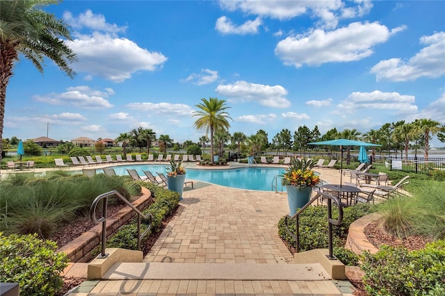 view of swimming pool featuring a patio