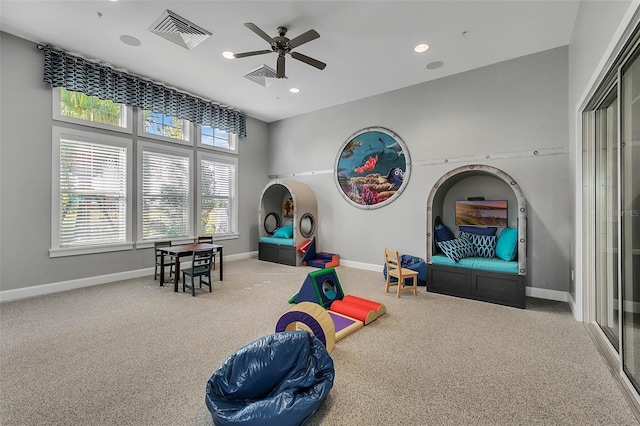 game room with ceiling fan and carpet