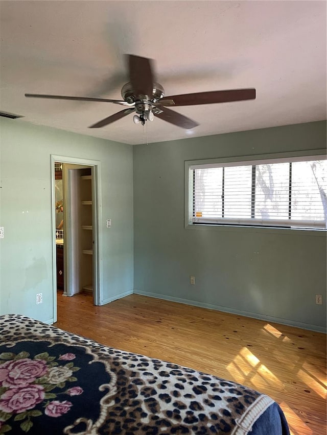 bedroom with ceiling fan and light hardwood / wood-style flooring