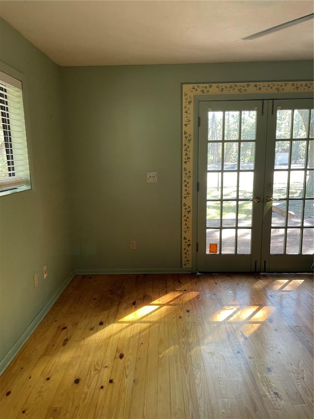 doorway to outside featuring light hardwood / wood-style floors and french doors