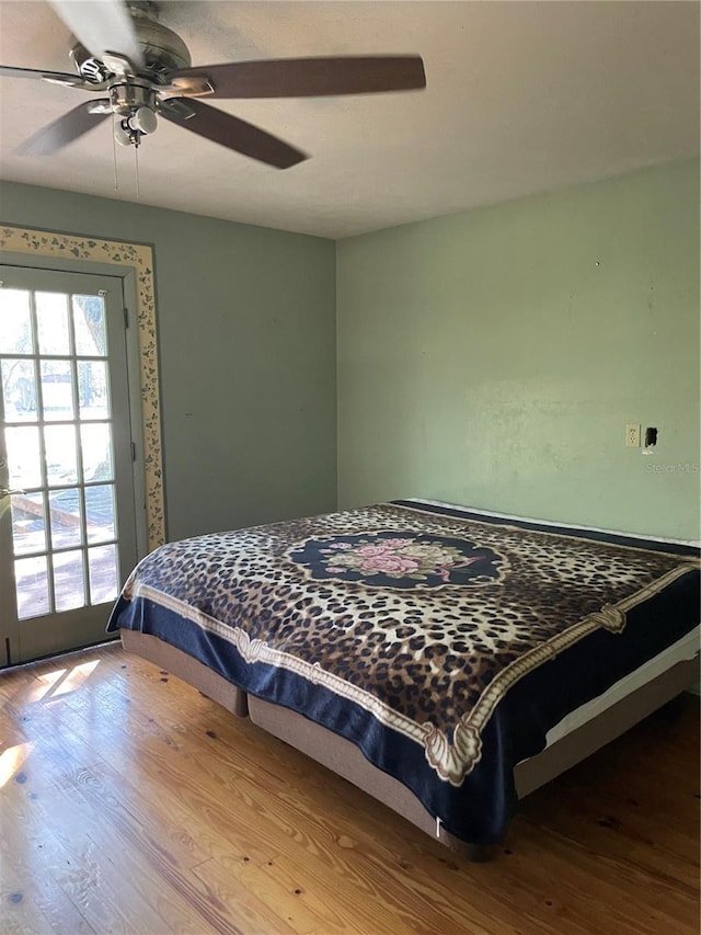 bedroom featuring ceiling fan and wood-type flooring