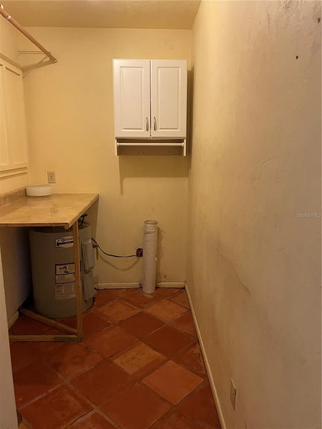 laundry room featuring electric water heater