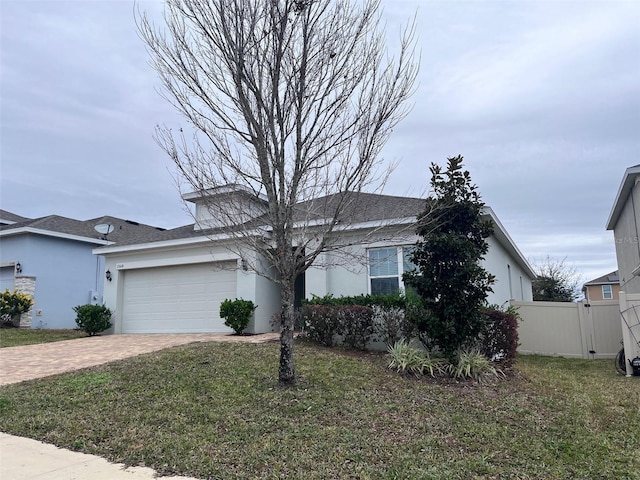 view of front facade with a front yard and a garage