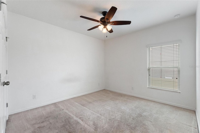 empty room with light carpet and ceiling fan