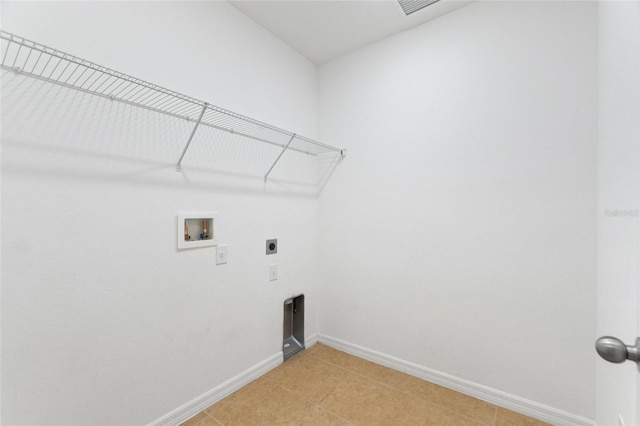 laundry room with hookup for a washing machine, light tile patterned floors, and hookup for an electric dryer