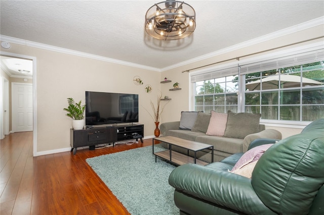 living room with an inviting chandelier, crown molding, dark hardwood / wood-style floors, and a textured ceiling