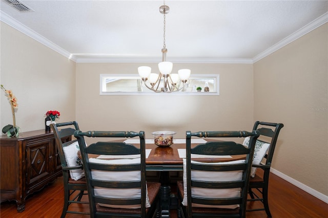 dining space featuring an inviting chandelier, ornamental molding, and dark hardwood / wood-style floors