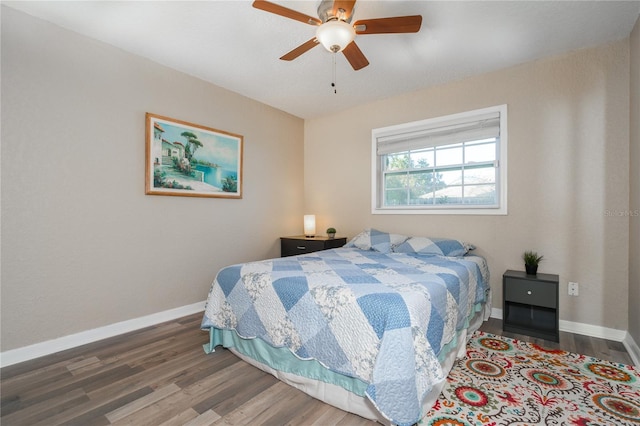 bedroom with hardwood / wood-style floors and ceiling fan