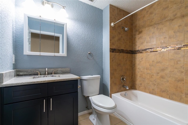 full bathroom featuring tile patterned flooring, vanity, a textured ceiling, toilet, and tiled shower / bath