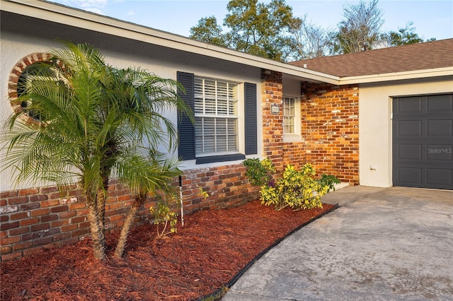 view of exterior entry featuring a garage