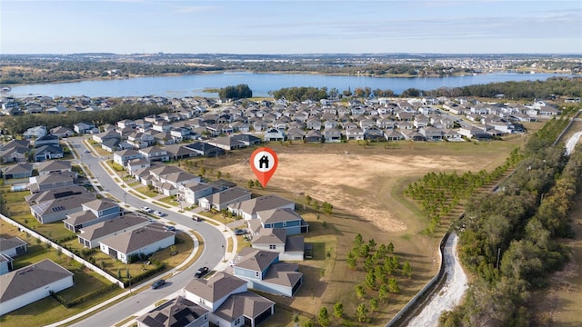 bird's eye view featuring a residential view and a water view