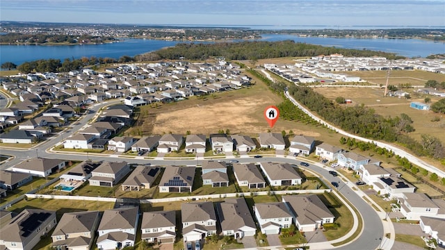 aerial view with a water view and a residential view