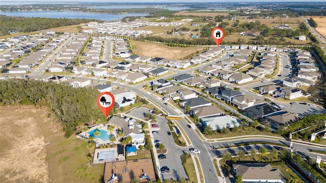 aerial view with a water view and a residential view