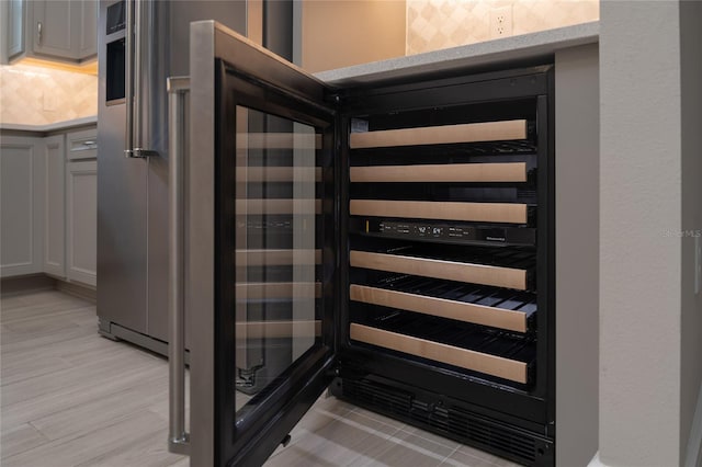 room details featuring backsplash and light wood finished floors