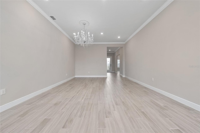 unfurnished living room with ornamental molding, light wood-type flooring, visible vents, and baseboards