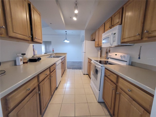 12216 Wild Iris Way Unit 112, Orlando, FL 32837 - kitchen featuring light countertops, a sink, brown cabinetry, light tile patterned floors, and white appliances
