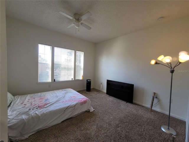 12216 Wild Iris Way Unit 112, Orlando, FL 32837 - bedroom featuring baseboards, carpet flooring, and a textured ceiling