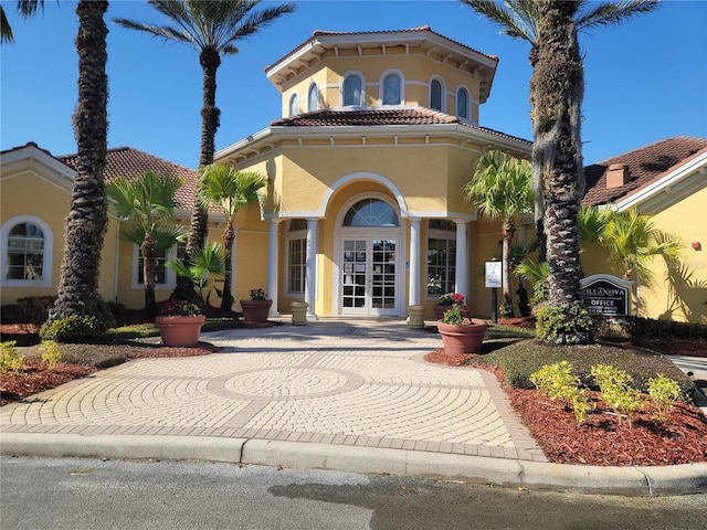 12216 Wild Iris Way Unit 112, Orlando, FL 32837 - view of front of house with a tile roof, stucco siding, and french doors