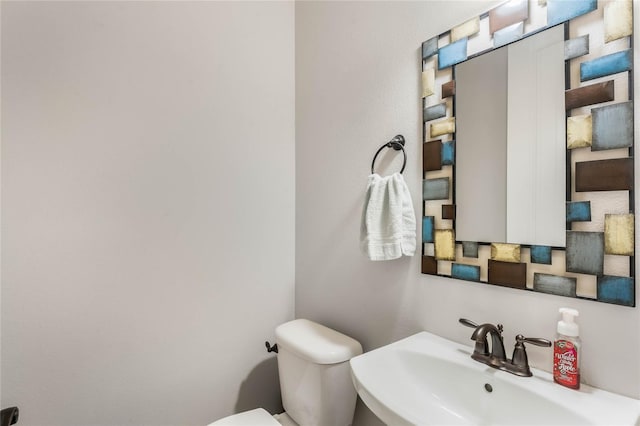 bathroom with toilet and sink