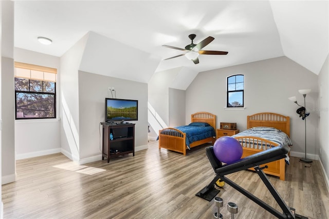 bedroom featuring lofted ceiling, ceiling fan, and light hardwood / wood-style floors