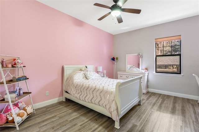 bedroom with ceiling fan and hardwood / wood-style floors