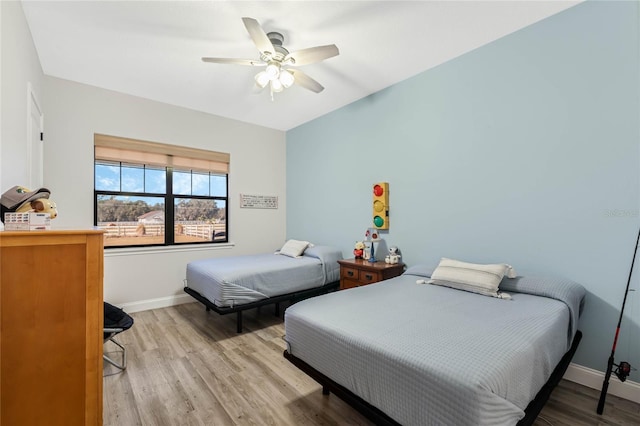 bedroom featuring ceiling fan and light hardwood / wood-style floors