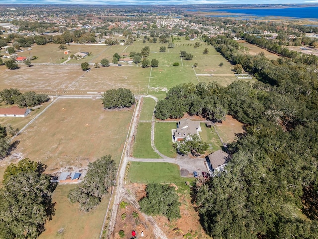 birds eye view of property with a rural view