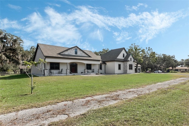 view of front facade with a porch and a front lawn