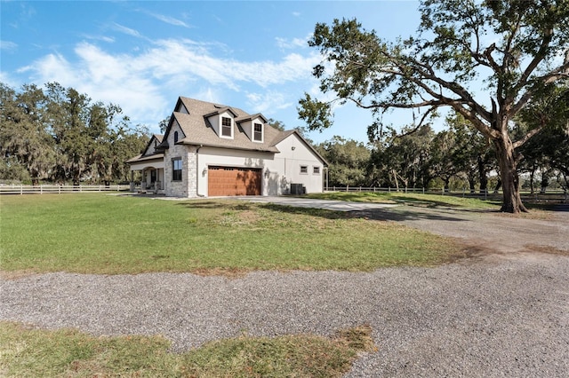 view of side of home with a garage and a lawn