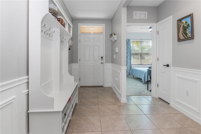 mudroom with light tile patterned flooring