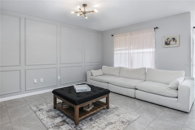 tiled living room featuring a notable chandelier