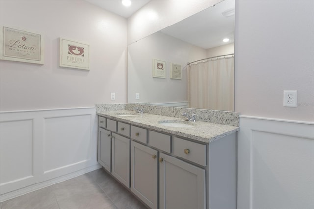 bathroom with vanity and tile patterned floors