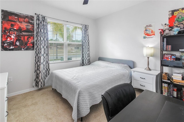 bedroom with light carpet and ceiling fan