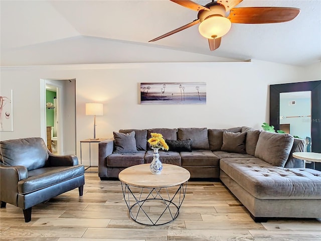 living room featuring lofted ceiling and ceiling fan