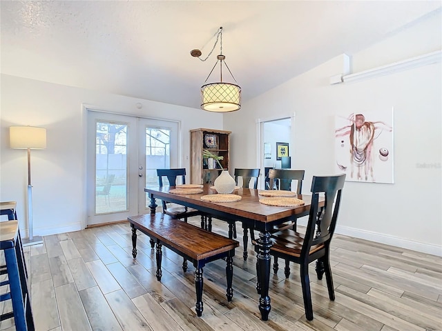 dining area featuring light hardwood / wood-style flooring and french doors