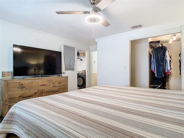 bedroom with washer / dryer, a closet, and ceiling fan