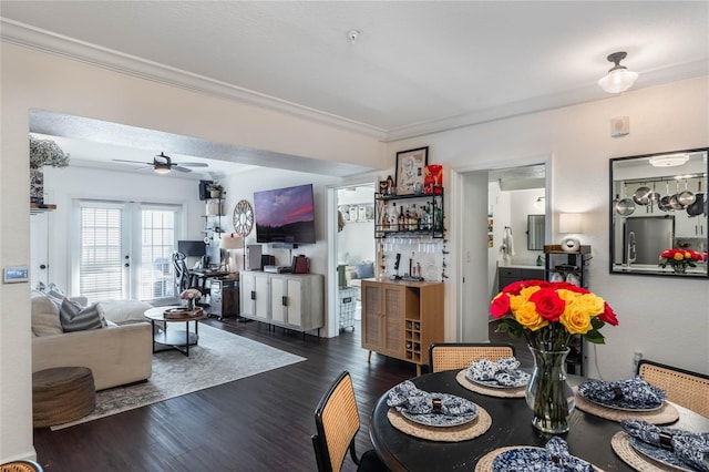 dining room featuring ceiling fan, dark hardwood / wood-style flooring, and ornamental molding