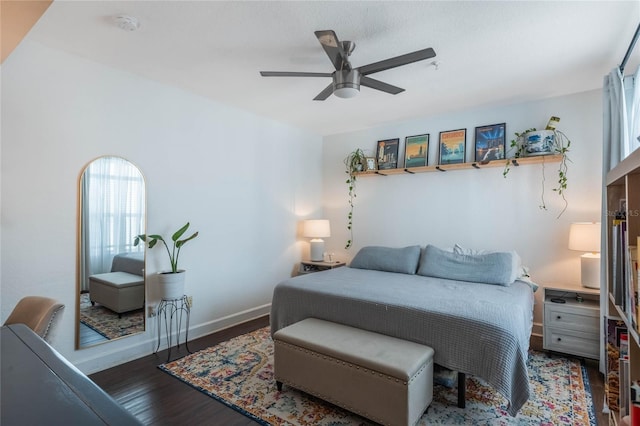 bedroom featuring ceiling fan and dark hardwood / wood-style flooring