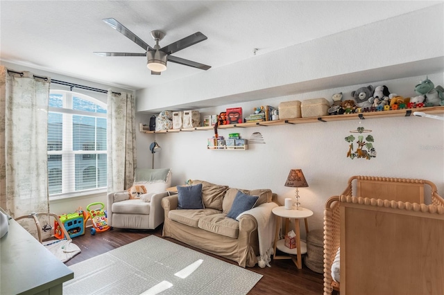 recreation room featuring ceiling fan and dark wood-type flooring